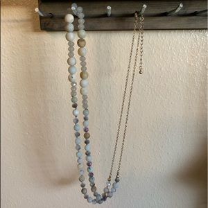 Multi-natural colored long beaded necklace.